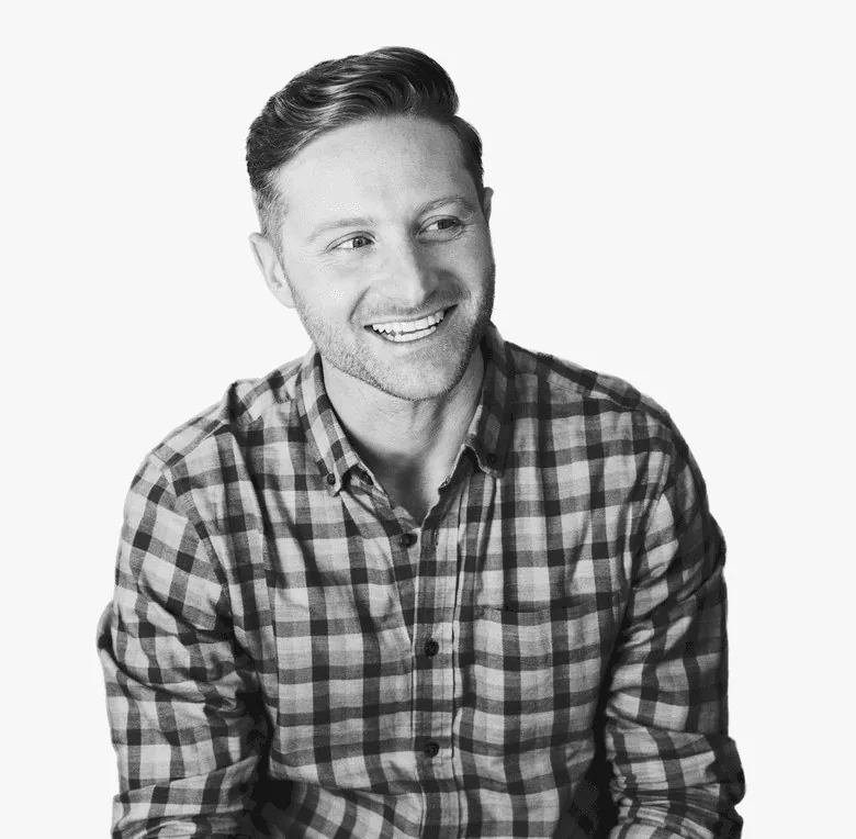 Kevin Cigolini, smiling, in a plaid shirt